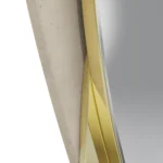 Details of Anti Mirror by Nolita Harbour, luxury wall mirror, crafted in textured plaster with brass contour accents, asymmetrical sculptural frame surrounding clear mirror glass, refined architectural design for contemporary spaces.