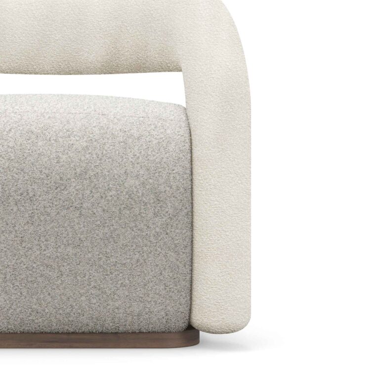 A stylish Emma Armchair with tubular armrests and backrest, featuring a fluffy seat, all upholstered in boucle. The chair combines modern design with cozy comfort.