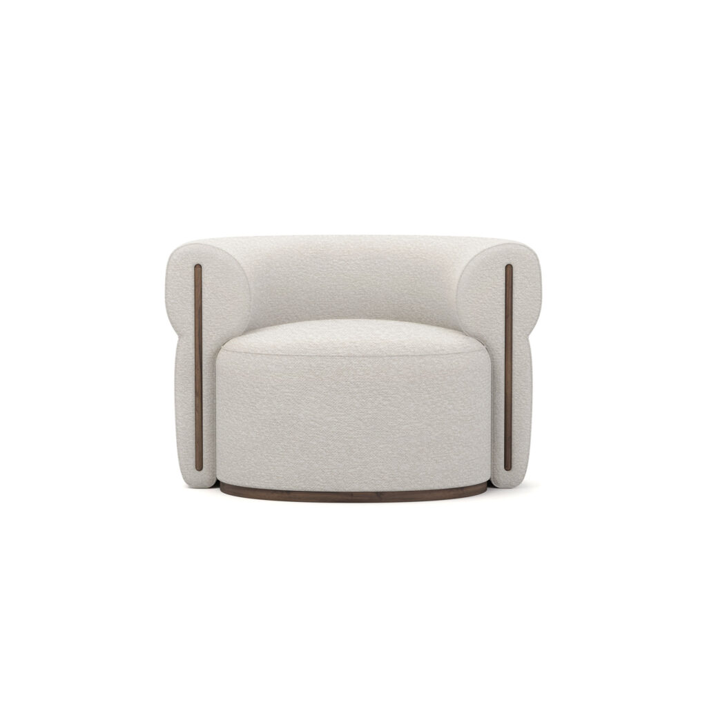 Front view of Camille Armchair showcasing its rounded design and walnut accents