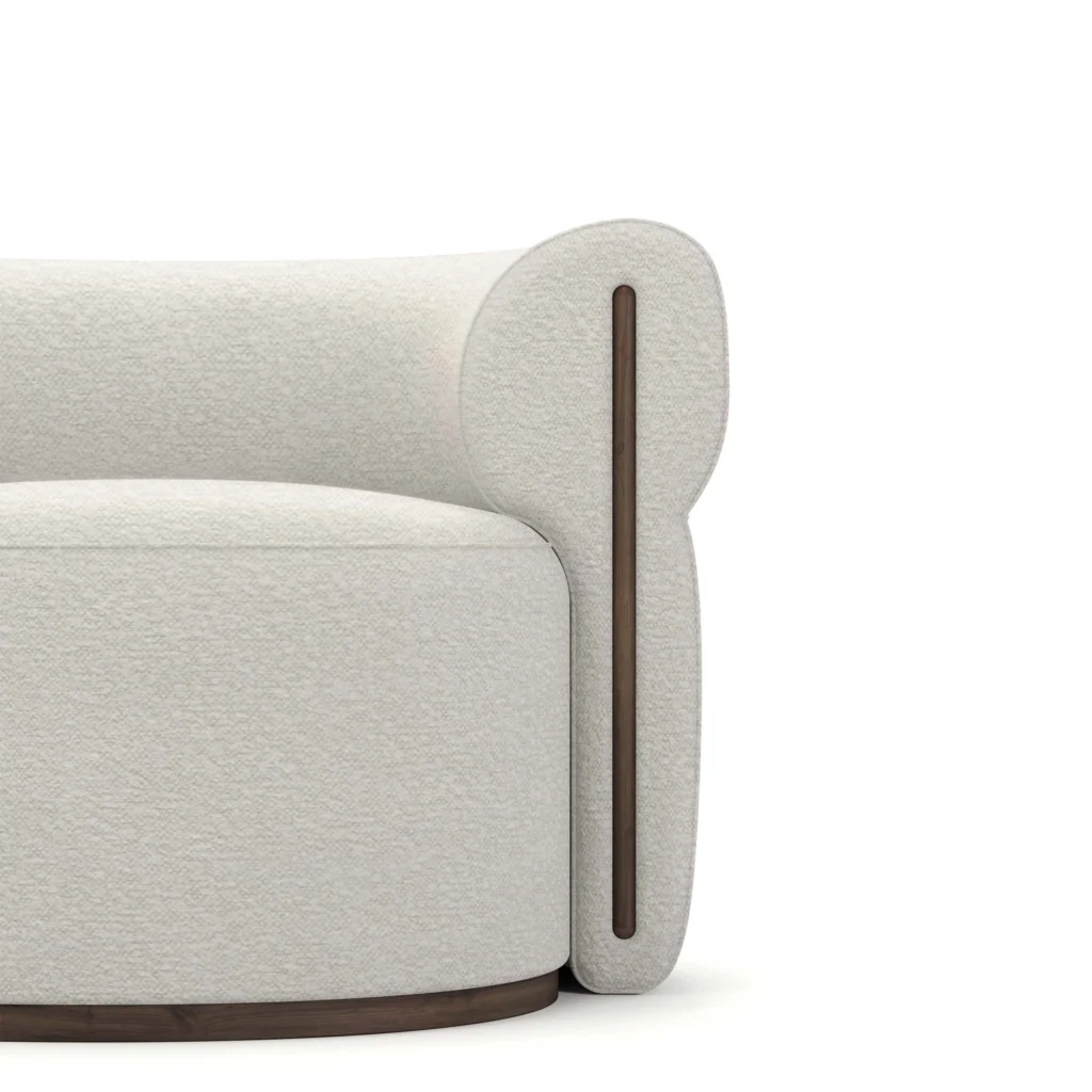 Camille bouclé armchair detail by Nolita Harbour, luxury lounge chair with curved shell and refined walnut base.