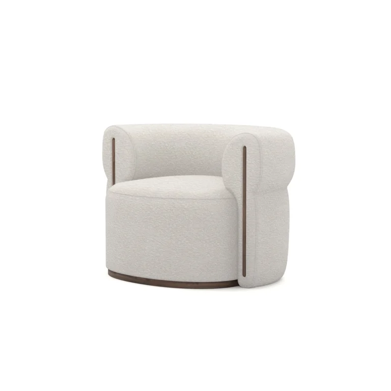 Camille armchair by Nolita Harbour, bouclé upholstered armchair with walnut base and sculptural rounded silhouette.