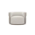 Camille designer armchair by Nolita Harbour, rounded bouclé lounge chair with refined walnut base and elegant silhouette.