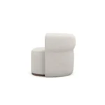 Camille contemporary armchair by Nolita Harbour, bouclé upholstered chair with circular seat and sculptural walnut detailing.