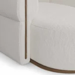 Camille upholstered sofa detail by Nolita Harbour, bouclé sectional sofa with soft curves, deep seat, and clean walnut base.