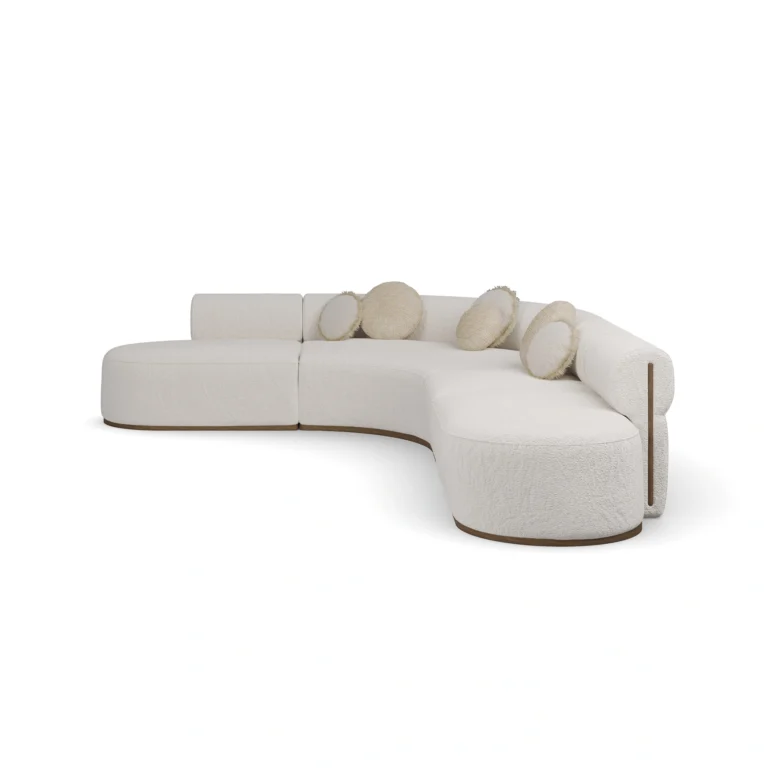 Camille sectional sofa by Nolita Harbour, bouclé upholstered curved sofa with modular design and low walnut plinth.