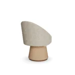 Caroline dining chair by Nolita Harbour, upholstered bouclé seat with cone base and architectural curved silhouette.