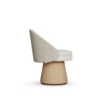 Caroline bouclé dining chair by Nolita Harbour, luxury upholstered chair with curved shell and refined walnut base.