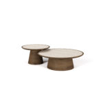 A modular round Liz Coffee Table featuring a matte walnut base and a travertine top. The table combines natural elegance with modern design.