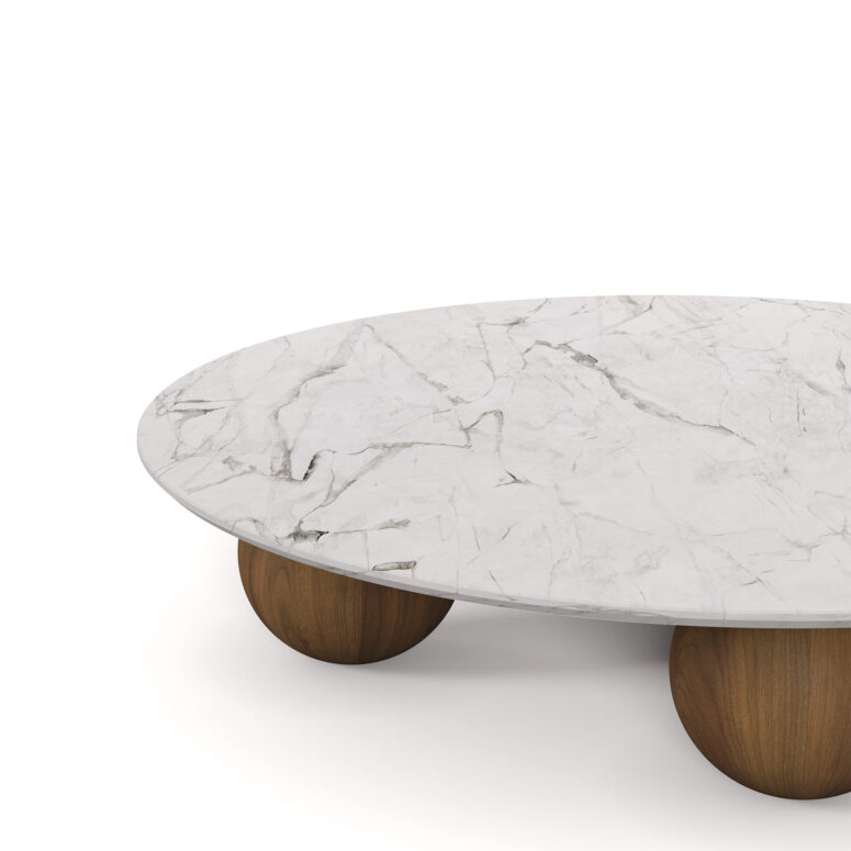 Nolita Harbour Jhoan Coffee Table with a sleek round marble top and unique wooden spherical legs.