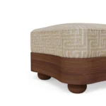 Detail of Nolita Harbour Colleen Stool, high-end upholstered stool in bouclé with matte walnut wood structure, showcasing a calm rounded profile with crisp seat edges and sculpted timber base, offering a balanced mix of softness and architectural precision for luxury interior design.