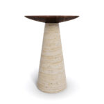 A minimalist side table named Lotte, featuring a conical travertine base and a matte walnut top. The base is elegantly tapered and supports a smooth, circular walnut surface, creating a blend of natural textures and modern design elements.