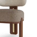 Diane bouclé dining chair by Nolita Harbour, luxury upholstered chair with rounded seat and refined walnut base.