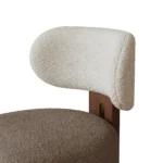 Diane contemporary dining chair details by Nolita Harbour, bouclé upholstered chair with rounded form and clean walnut structure.