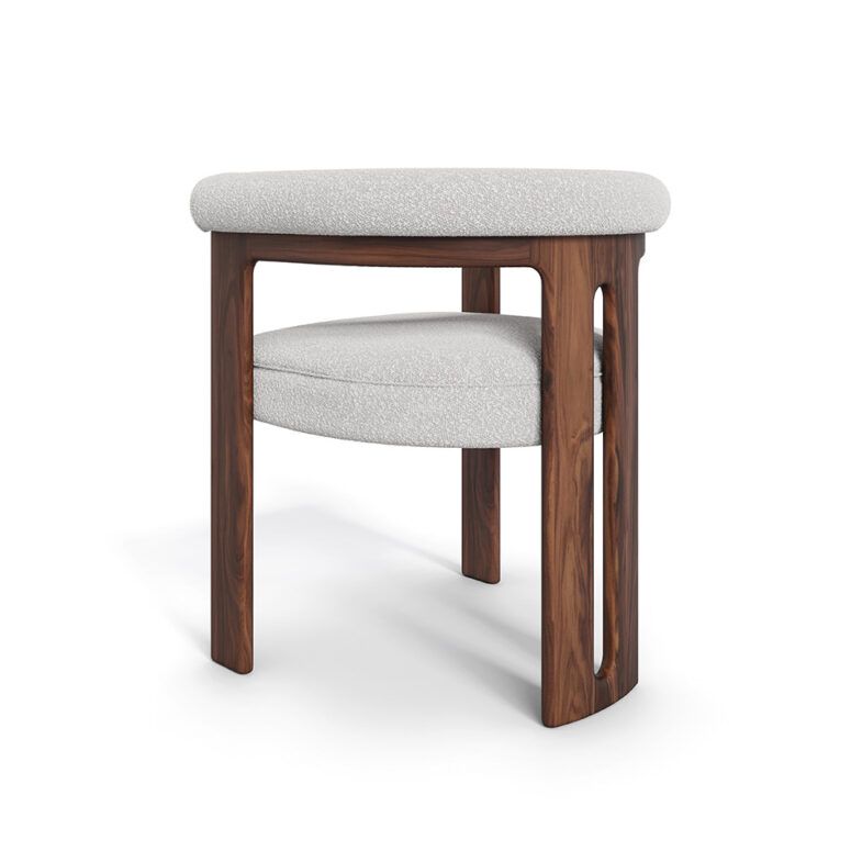 Mathilde dining chair with a unique three-leg walnut base and plush bouclé fabric upholstery, offering both comfort and modern elegance for dining spaces.