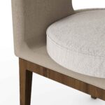 Close-up of Tamara Dining Chair's cushioned seat and fabric upholstery