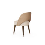 Nolita Harbour Paris Dining Chair with plush seat and backrest upholstered in premium fabric.