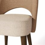 Nolita Harbour Paris Dining Chair with plush seat and backrest upholstered in premium fabric.