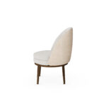 Nolita Harbour Caroline Dining Chair with a plush, round seat and distinctive shell-like backrest in premium boucle fabric.