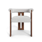 Mathilde dining chair with a unique three-leg walnut base and plush bouclé fabric upholstery, offering both comfort and modern elegance for dining spaces.