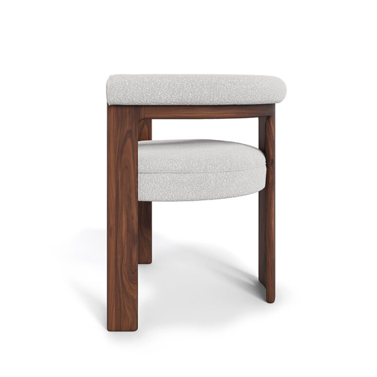 Mathilde dining chair with a unique three-leg walnut base and plush bouclé fabric upholstery, offering both comfort and modern elegance for dining spaces.