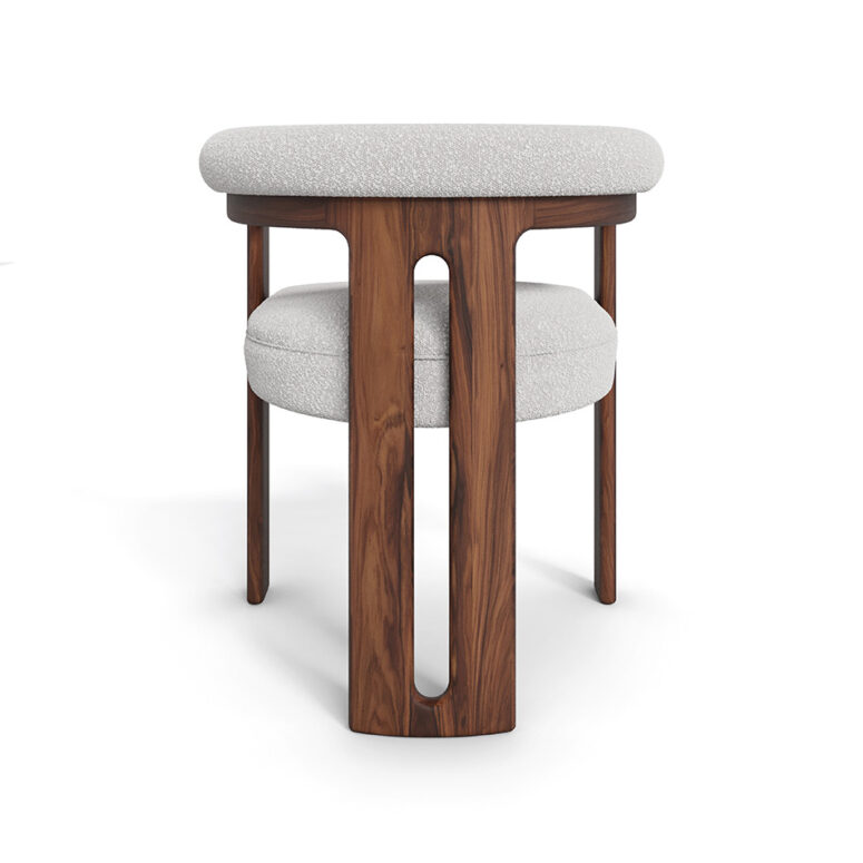 Mathilde dining chair with a unique three-leg walnut base and plush bouclé fabric upholstery, offering both comfort and modern elegance for dining spaces.