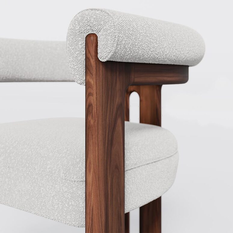 Mathilde dining chair with a unique three-leg walnut base and plush bouclé fabric upholstery, offering both comfort and modern elegance for dining spaces.