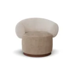 Elise luxury armchair by Nolita Harbour, curved bouclé lounge chair with rounded form and architectural walnut base.