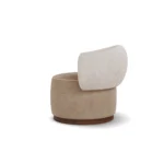 Elise armchair by Nolita Harbour, sculptural bouclé chair with crescent back, smooth seat, and elegant walnut plinth.