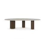Élodie Dining Table, a modern dining table by Nolita Harbour in stone and wood, offering a soft oval silhouette.