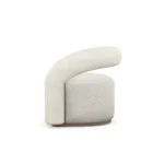 Emma armchair by Nolita Harbour, bouclé upholstered armchair with walnut plinth, sculptural side profile, and elegant curved architectural form.