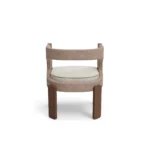 Fay designer dining chair by Nolita Harbour, bouclé upholstered chair with cut-out back and refined walnut base.