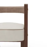 Fay contemporary dining chair details by Nolita Harbour, upholstered chair with crescent back and sculptural walnut structure.