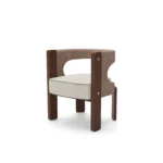 Fay dining chair by Nolita Harbour, bouclé upholstered chair with walnut frame and crescent back, sculptural modern design.