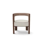 Fay walnut dining chair by Nolita Harbour, bouclé upholstered seat with crescent silhouette and elegant sculptural frame.