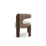 Fay dining chair by Nolita Harbour, upholstered bouclé seat with walnut frame and crescent silhouette.