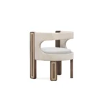 Goldie dining chair by Nolita Harbour, velvet seat with walnut frame, brass detailing, and sculptural crescent silhouette.