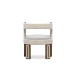 Goldie luxury dining chair by Nolita Harbour, velvet upholstered chair with curved cut-out back and elegant walnut base.