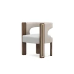 Goldie dining chair by Nolita Harbour, velvet upholstered chair with walnut frame and brass feet, sculptural crescent-back design.