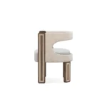 Goldie walnut dining chair by Nolita Harbour, velvet seat with curved cut-out back and polished brass foot detail.