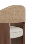Junna dining chair by Nolita Harbour, upholstered bouclé seat with walnut frame and refined architectural design.