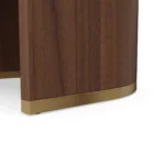 Junna contemporary dining chair detail by Nolita Harbour, bouclé upholstered chair with open-back silhouette and tapered wood legs.