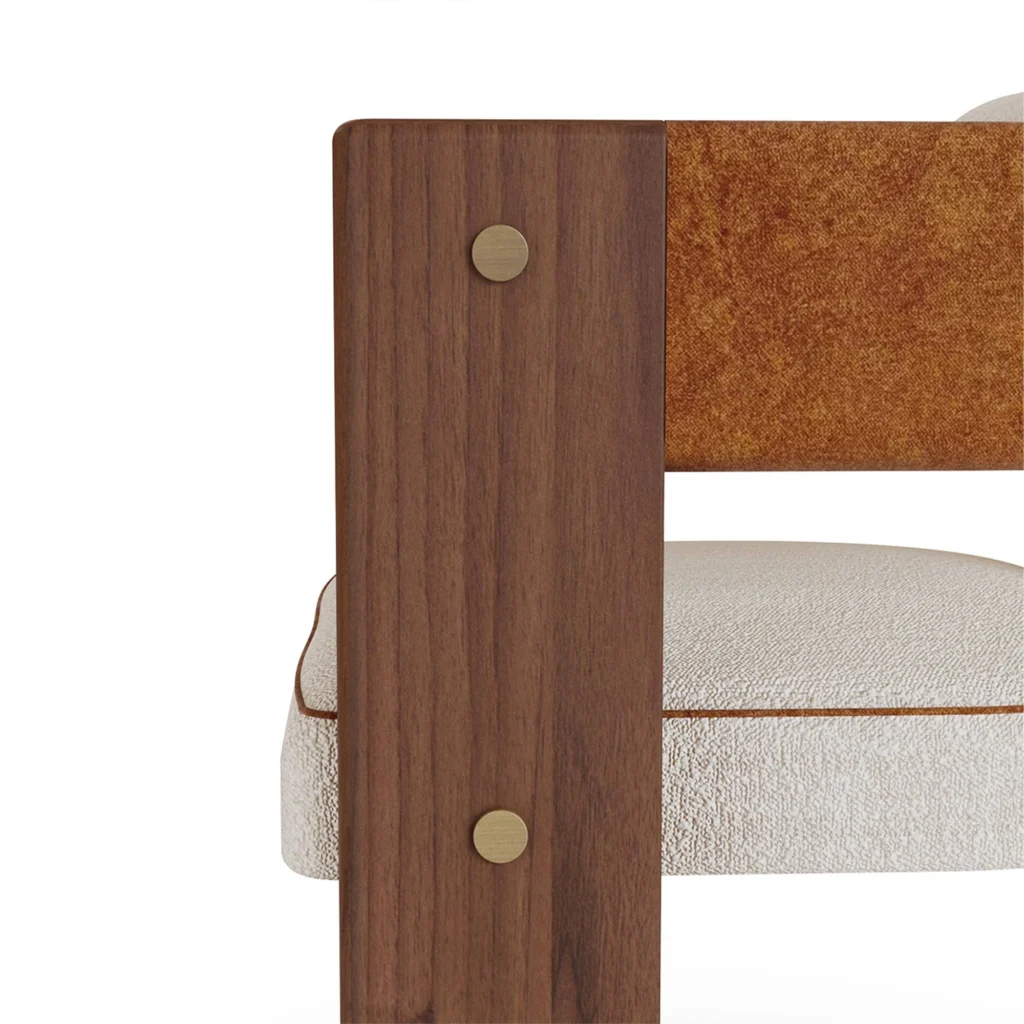 Lana dining chair detail by Nolita Harbour, upholstered seat with sculptural curved silhouette and grounded timber base.