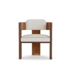 Lana upholstered dining chair by Nolita Harbour, luxury chair with soft curved back, padded seat, and elegant wood legs.