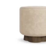 Mae vanity stool detail by Nolita Harbour in velvet upholstery, compact round stool with refined padded seat and soft curved silhouette.