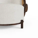 Marie contemporary armchair by Nolita Harbour, circular bouclé chair with walnut uprights and refined sculptural form.