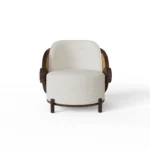 Marie luxury armchair by Nolita Harbour, bouclé upholstered chair with open-back silhouette and architectural wood detailing.
