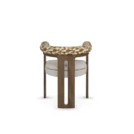 Mathilde walnut dining chair by Nolita Harbour, bouclé upholstered seat with sculptural curved back and elegant wood base.