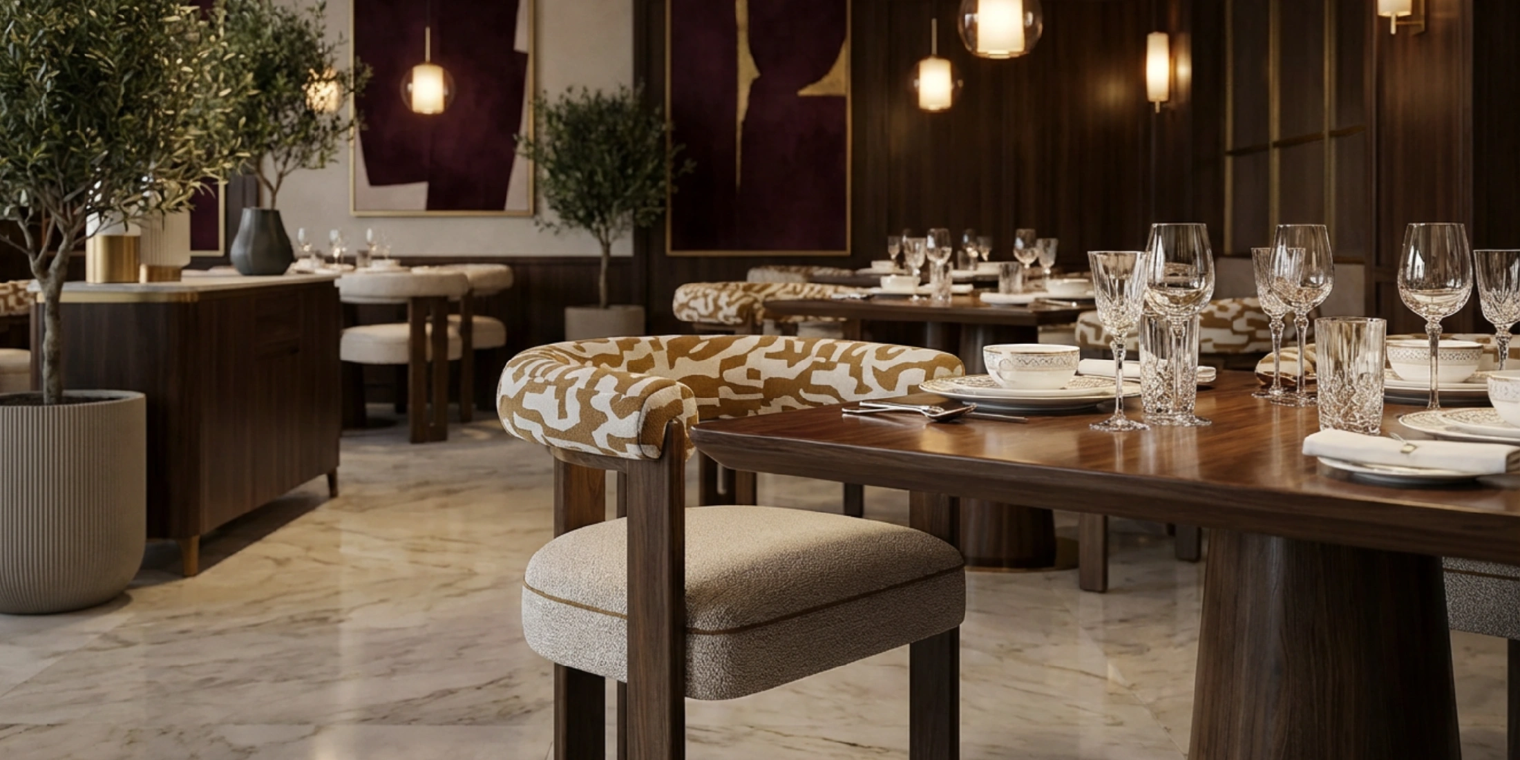 Mathilde dining chair by Nolita Harbour, bouclé upholstered chair with walnut frame and curved arms, refined seating in a luxury dining interior.