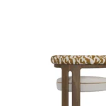 Mathilde dining chair detail by Nolita Harbour, bouclé upholstered chair with walnut frame and curved arms, refined architectural design.