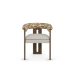 Mathilde luxury dining chair by Nolita Harbour, upholstered bouclé chair with curved back and warm walnut structure.